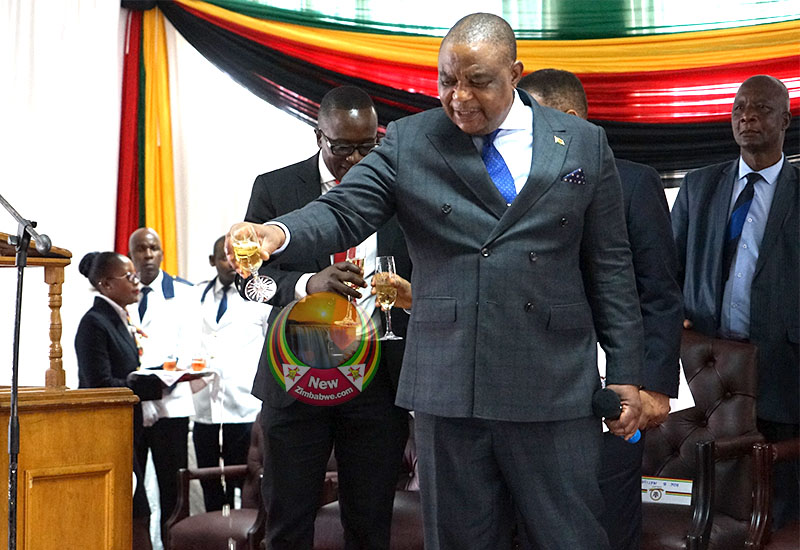 Acting President Constantine Chiwenga pouring champagne on the floor as way of celebrating
