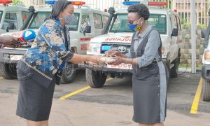 Susan Kitariko the manager SICPA handing over ambulance keys to the health minister Dr Jane Ruth Acheng Photos by Agnes Kyotalengerire 671x403 1