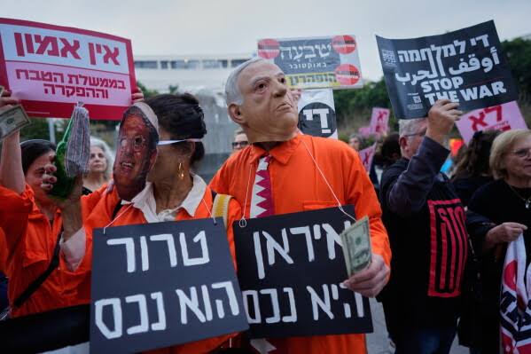 Missile shaped signs and Netanyahu masks